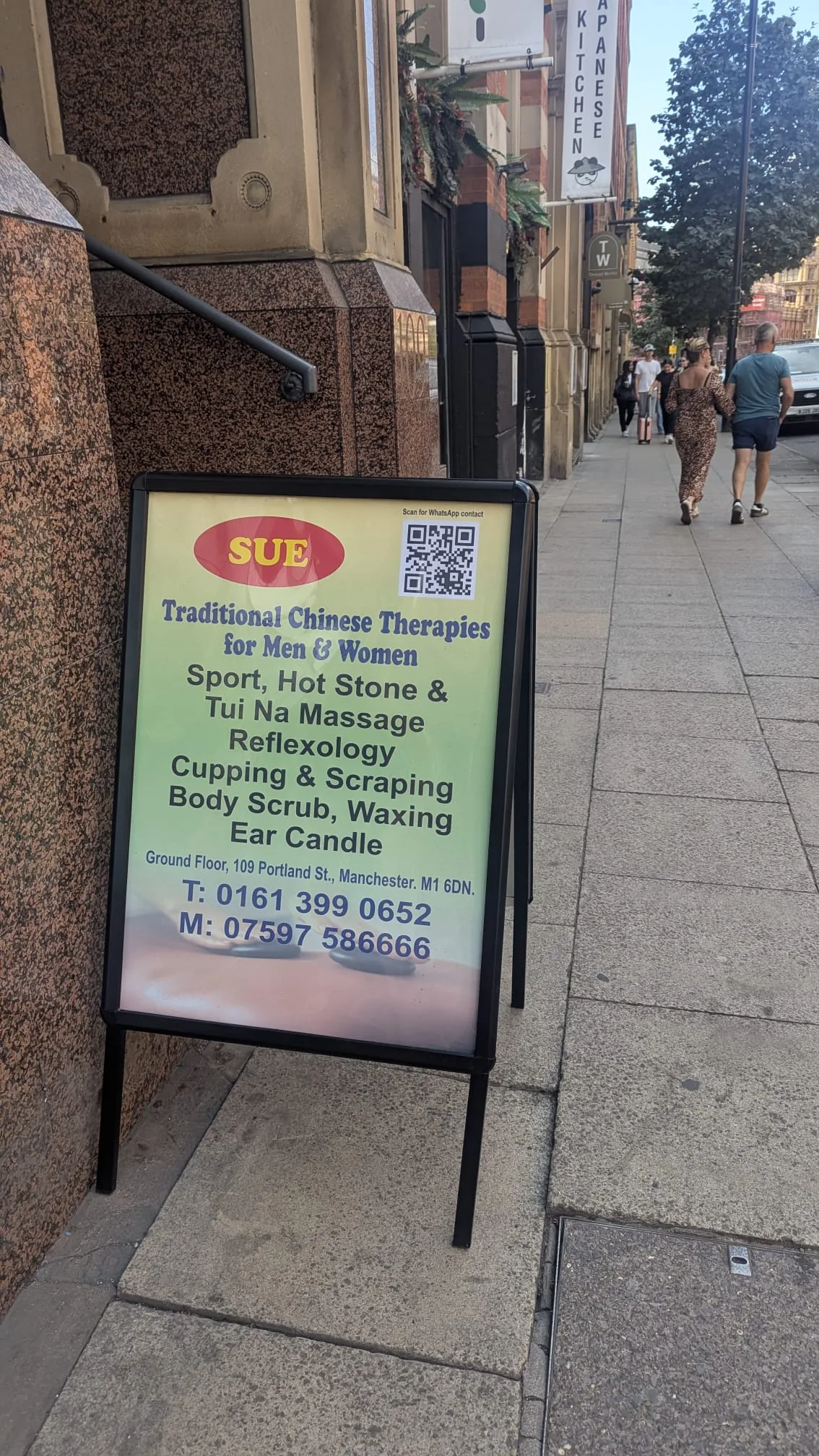 SUE pavement sign outside the Portland Street premises in Manchester